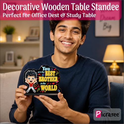 Image of PICRAZEE Raksha Bandhan Gift for Brother - Rakhi, 12 inch Cushion with Filler, Mug, Table Standy, Roli-Chawal Bottles, Keyring, Fridge Magnet & Greeting Card (Best Brother)