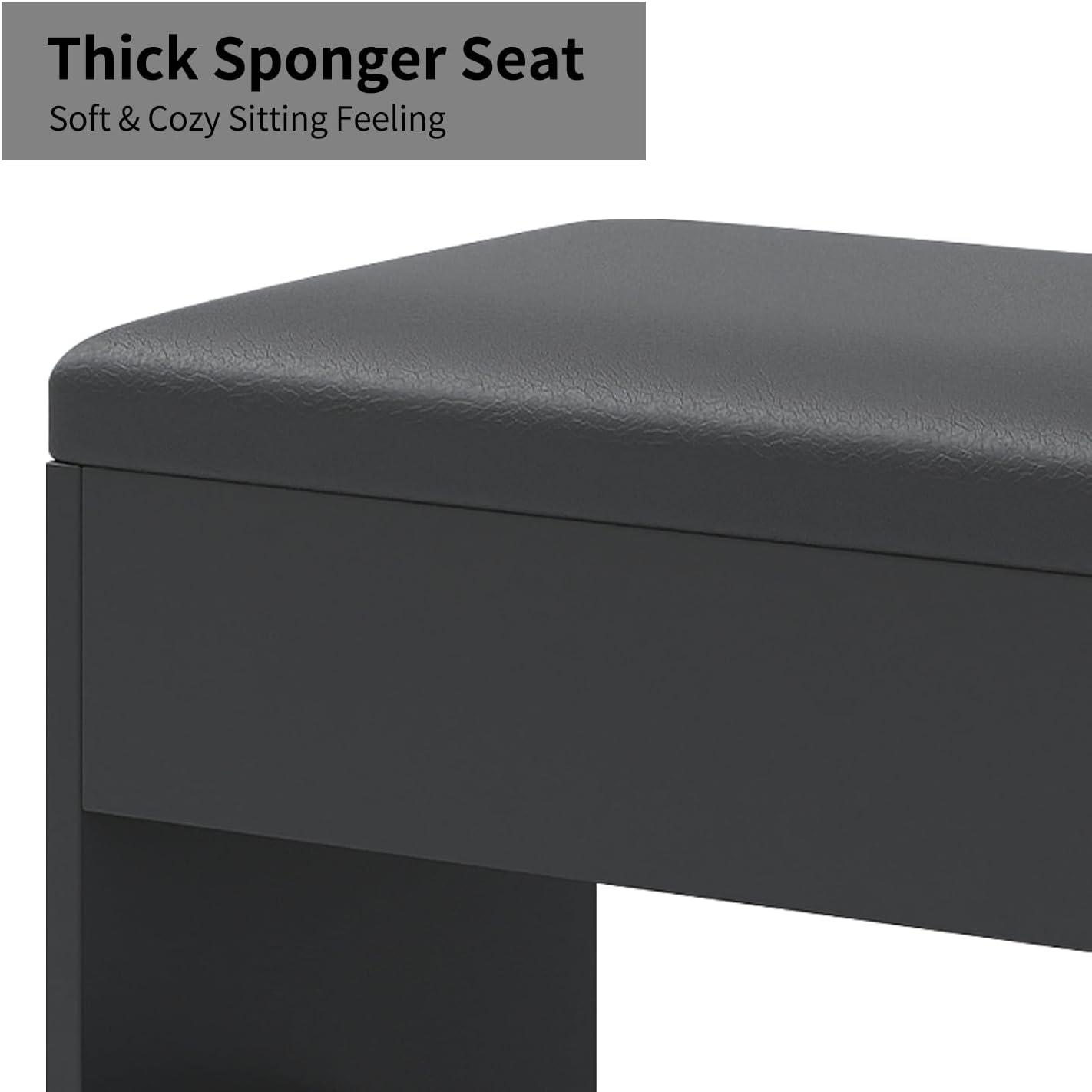 Close-up of the thick, padded stool included with the vanity desk, upholstered in black material.