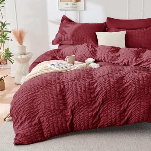Image of HYMOKEGE Burgundy Oversized Queen Comforter Set Seersucker 7 Pieces, All Season Luxury Bed in a Bag for Bedroom, Bedding Set with Comforter, Sheets, Pillowcases & Shams