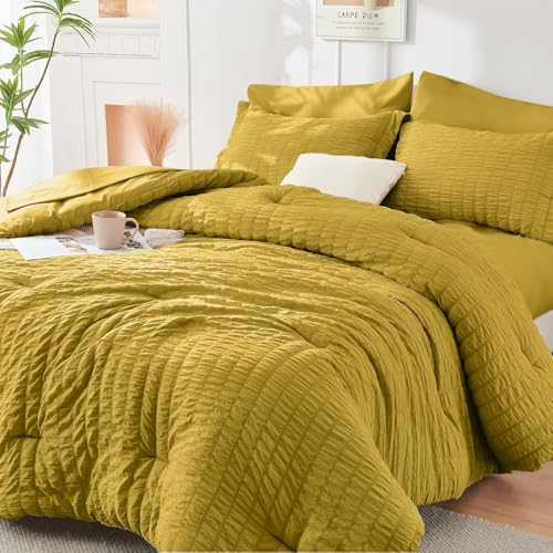 Image of HYMOKEGE Mustard Yellow California King Comforter Set Seersucker 7 Pieces, All Season Luxury Bed in a Bag for Bedroom, Bedding Set with Comforter, Sheets, Pillowcases & Shams