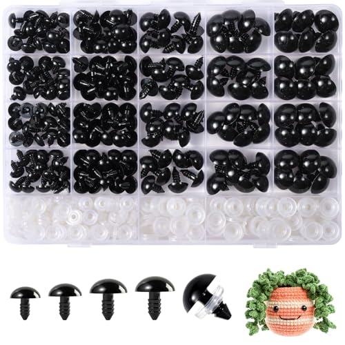 1 - The Creative Folk A compartment box of black plastic safety eyes and noses in graded sizes with white washers below, beside five loose eyes and a small crocheted toy