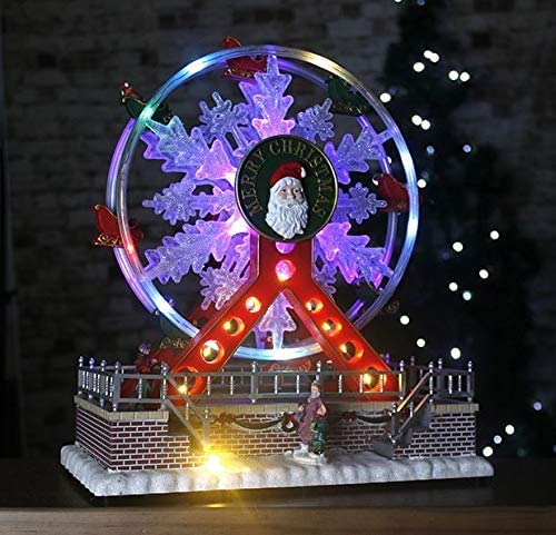 HomeZone Big Wheel Animated Christmas Carol Village Nativity Scene Adorno con luces LED que cambian de color y sonidos. Funciona con pilas