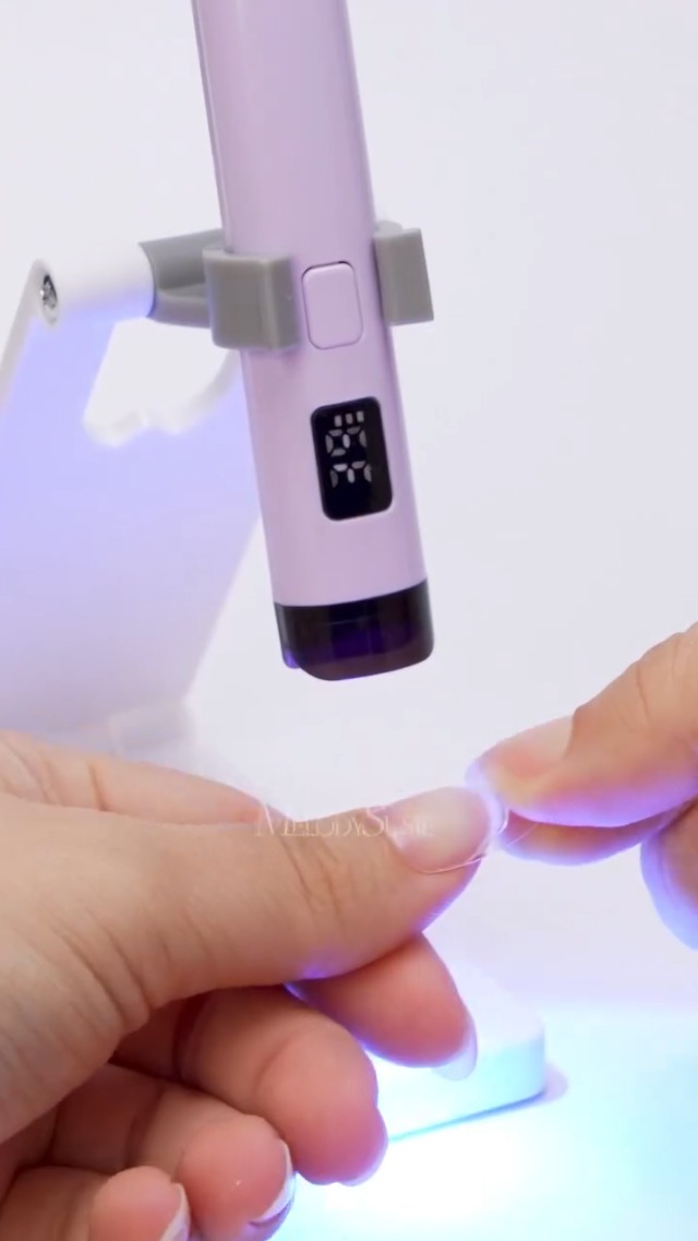 Image of MelodySusie Handheld UV Light for Gel Nails with Stand, Mini Portable Cordless Nail Lamp with LCD Display, Eye-Protective Cover, Flash Curing for Glue, Purple