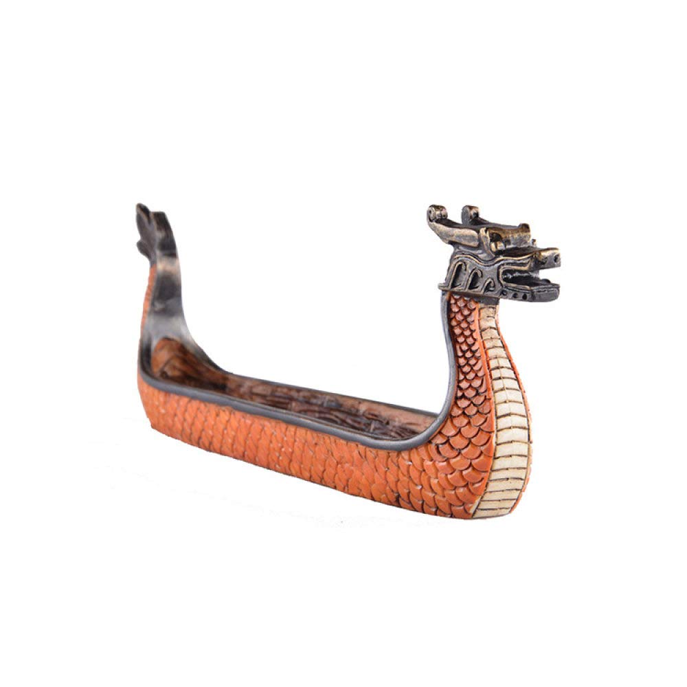 Mignon mini dragon bateau sur votre tableau de bord ou étagère de salon