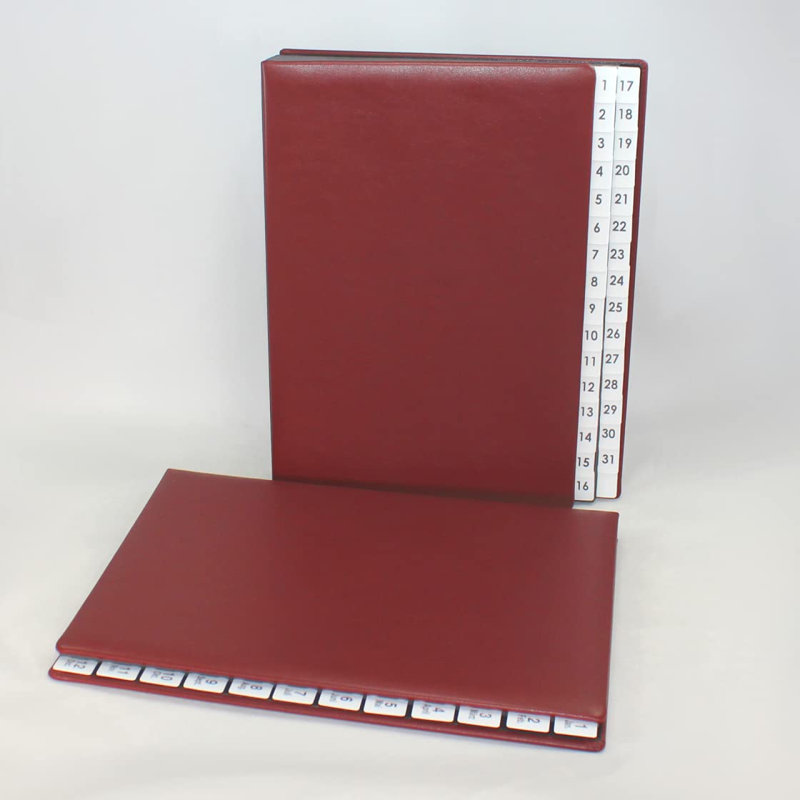 Carpeta clasificadora con registro 1-31 de piel de vacuno lisa en color rojo vino
