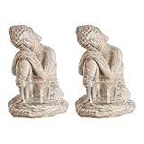 Pon a la última tu hogar decorando con la conocida regla de la simetría usada por los decoradores con estos 2 representativos portavelas de Buda.