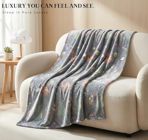 Image of BSB HOME Glow in The Dark Kids Blanket, Soft Flannel Fleece Luminous Blanket for Boys & Girls, Cozy Lightweight Kids Throw for Bed - 42 x 60 in (107 x 152 cm) (Dinosaur & Space Theme - Charcoal Grey)