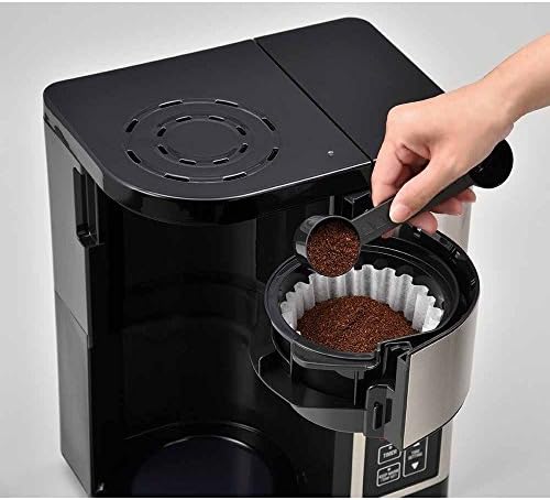 Coffee grounds in a paper filter inside the Zojirushi coffee maker's filter basket