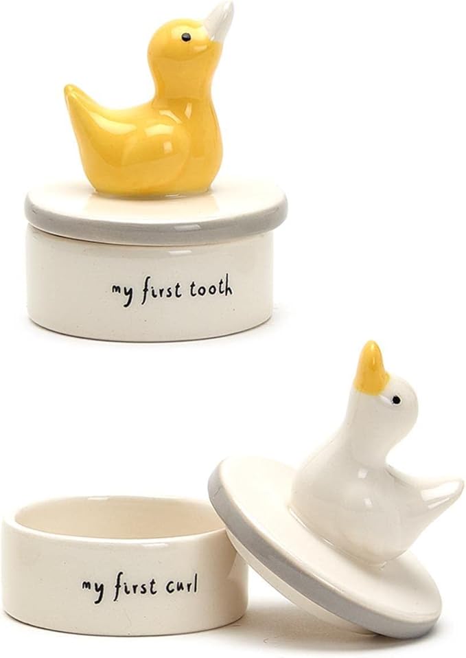 Two's Company Lucky Duckie First Tooth & First Curl Keepsake Set is a charming and practical way to commemorate the special moments of a child's first tooth and first curl. This set includes two separate silver-plated keepsake boxes, each featuring an adorable lucky duckie design on the lid. The boxes are nestled inside a beautifully presented gift box, making it a perfect gift for new parents or for a baby shower.
The First Tooth keepsake box is designed to hold and protect the precious first tooth that a child loses, while the First Curl box is perfect for storing that cherished lock of hair from the baby's first haircut. The silver-plated finish gives these keepsake boxes a timeless and elegant look that will be treasured for years to come. This set is a lovely way to celebrate and remember these important milestones in a child's life.
Overall, Two's Company Lucky Duckie First Tooth & First Curl Keepsake Set is a thoughtful and unique gift that captures the magic of a child's early years. Whether for your own child or as a gift for someone else, this set is sure to be a cherished keepsake that brings back memories for years to come. Description by ChatGPT.