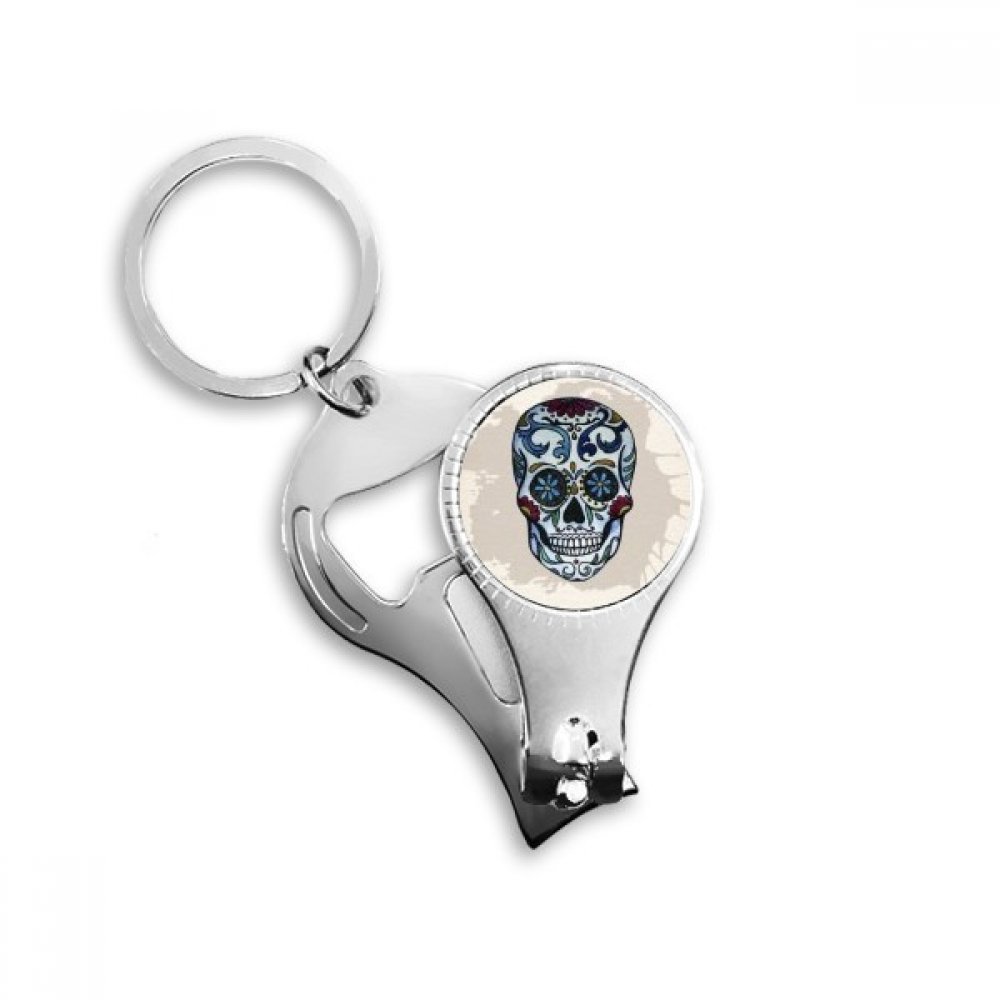 Coupe-ongles et décapsuleur intégrés sur porte-clés métal gris au motif crâne mexicain