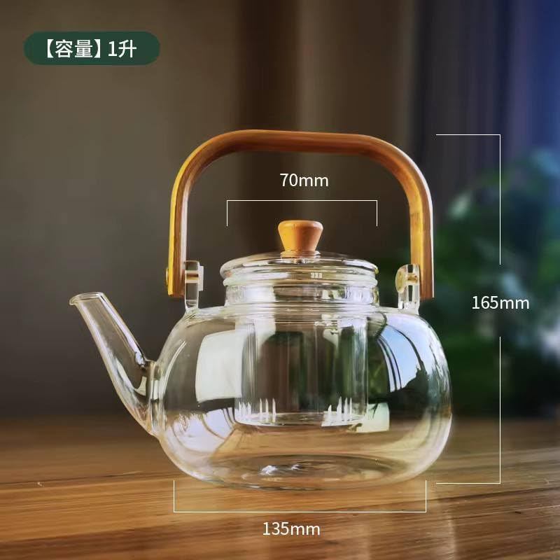 Diagram showing the dimensions of the glass teapot: 165mm height, 135mm width, 70mm infuser diameter