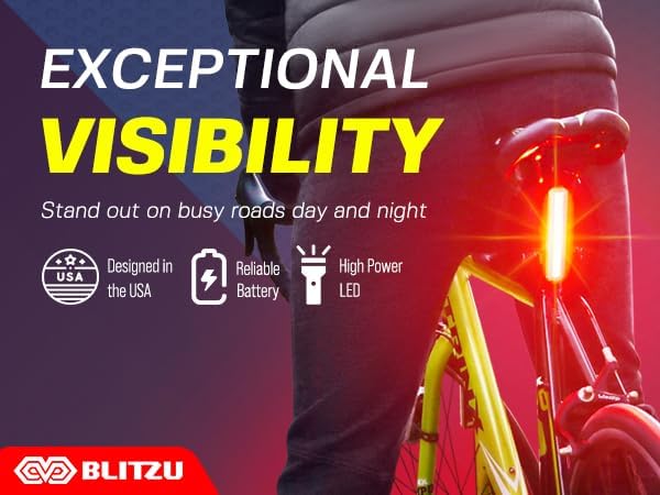 BLITZU Cyborg 168T Rear Bike Light connected to a laptop via USB for charging.