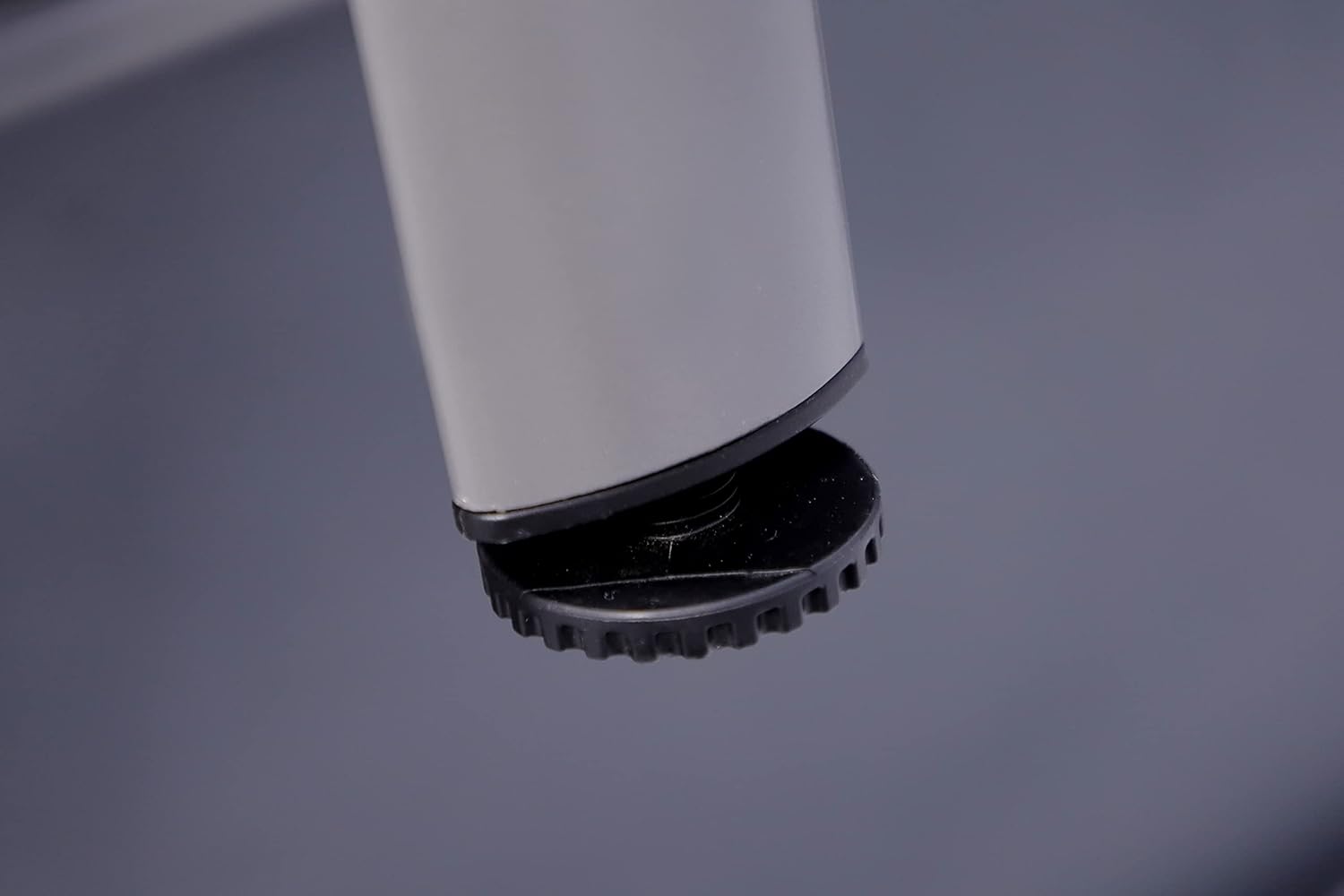 Adjustable leg leveler on KETTLER table