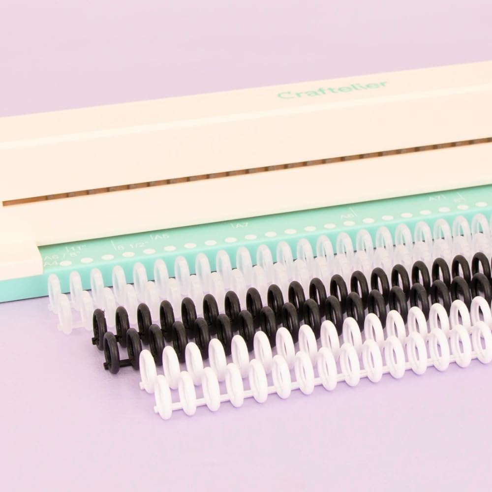 Craftelier - Encuadernadora Manual de 30 Agujeros - Perforadora con 6 Anillas Tonos Blanco y Negro - Perfora hasta 5 Hojas - Compatible con Tamaños de A4, A5, A6, A7 - Para Cuadernos y Scrapbooking