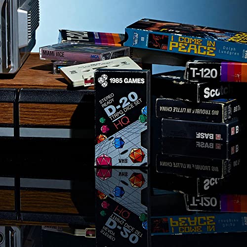 Image of 1985 Games Sharp Edge DND Dice Set - Plasmic Punch Polyhedral Dice in Retro VHS Box - TTRPG Dice Set - Tabletop RPG Accessory (Set of 7)