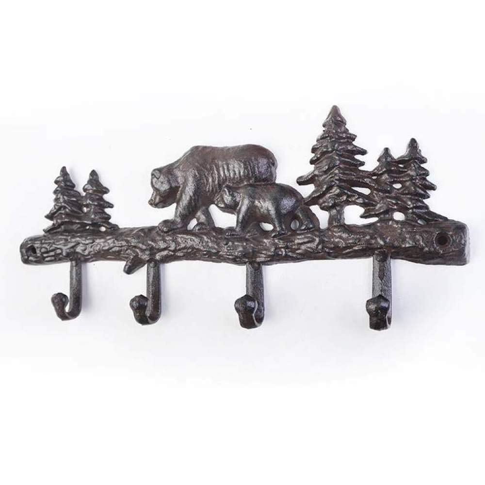 Arbre de noël en fonte et patère ours pour une entrée chalet chaleureuse