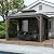 Outsunny 10' x 12' Hardtop Gazebo with Curtains and Netting, Permanent Pavilion Metal Double Roof Gazebo Canopy with Aluminum Frame and Hooks, for Garden, Patio, Backyard, Dark Brown