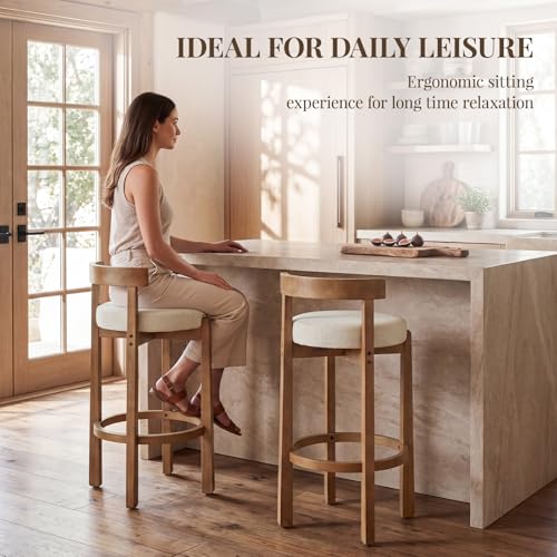 Image of LukeAlon Mid Century Linen Bar Stools Set of 2, 30.25 inch Seat Height Upholstered Barstools with Wood Legs Modern Tall Bar Chair with Curved Low Back Round Footrest for Pub Home Kitchen Island, Beige
