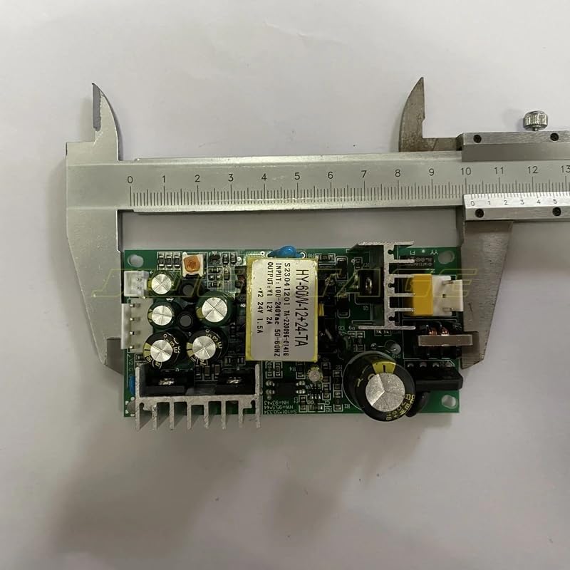 สูงสุด view of the power supply board being measured with a caliper, showing its length.