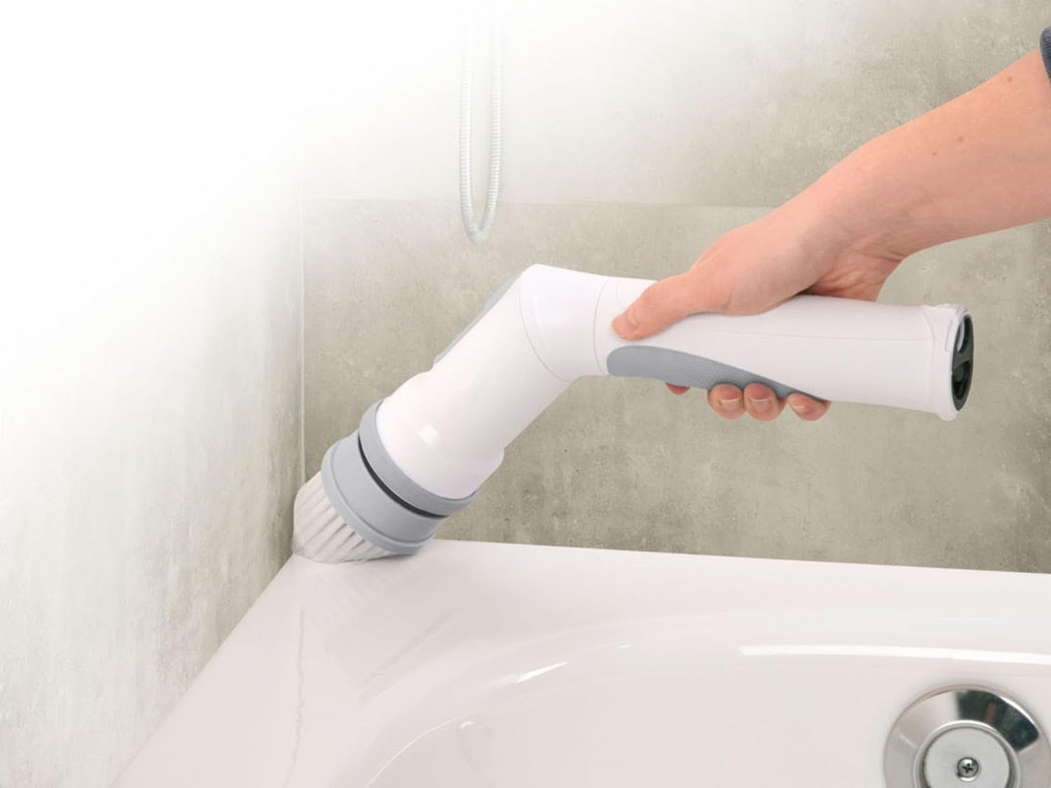 Three interchangeable brush heads: flat, round, and conical.