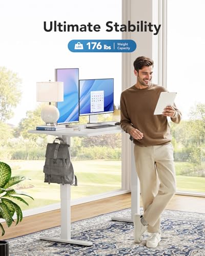 Image of HUANUO Electric Standing Desk, Whole Piece Desktop, Adjustable Height Computer Desk, 4 Height Memory Settings, Sit Stand Up Desk for Home Office, 55 inch x 27 inch, White