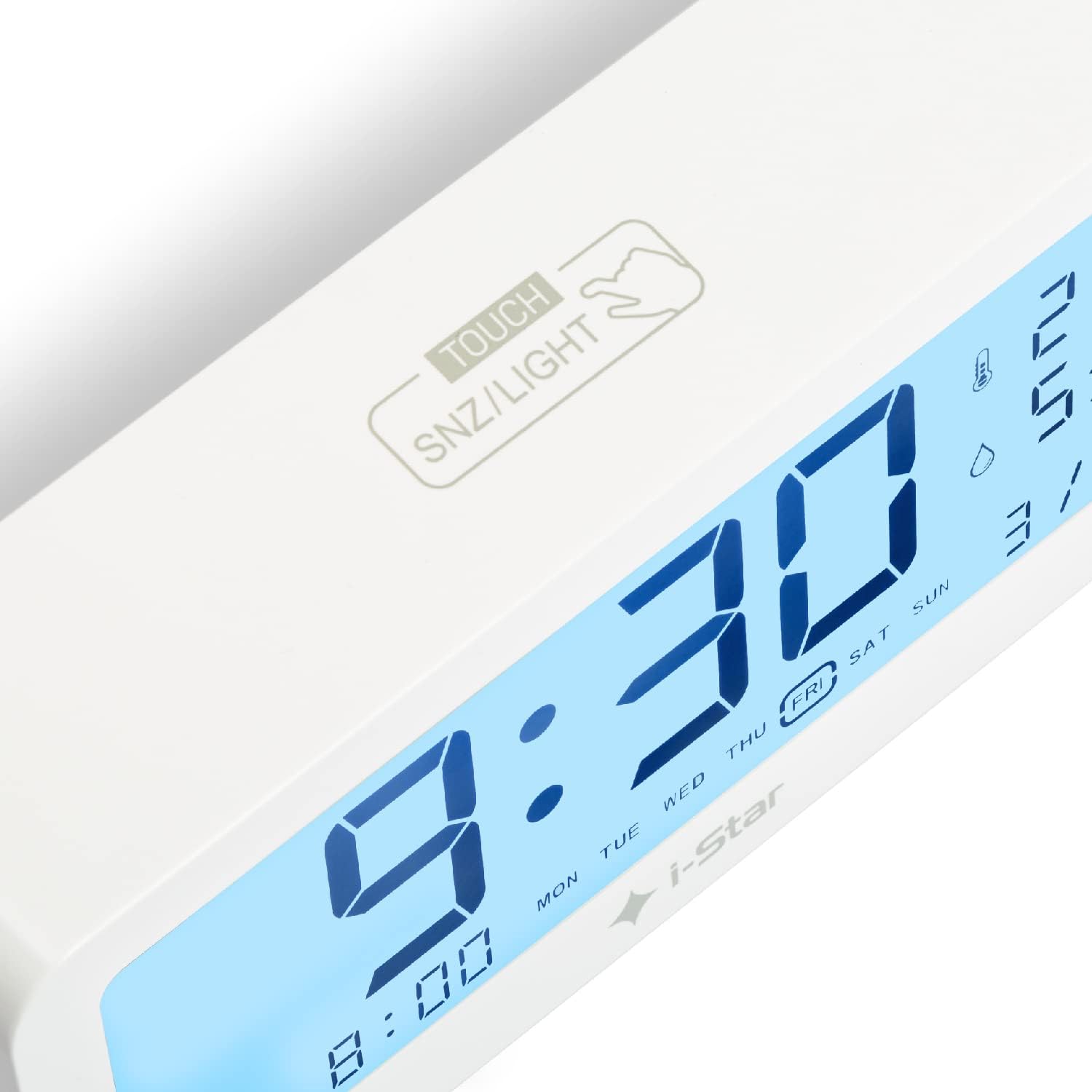 Close-up of the top of the I-Star Digital Alarm Clock showing the 'TOUCH SNZ/LIGHT' area