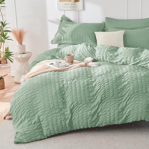 Image of HYMOKEGE Sage Green Oversized King Comforter Set Seersucker 7 Pieces, All Season Luxury Bed in a Bag for Bedroom, Bedding Set with Comforter, Sheets, Pillowcases & Shams