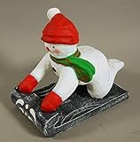 E+N Schnee-Mann, Schnee-Kind, Winter-Kind, auf Schlitten, rote Mütze, grüner Schal, rote Handschuhe, HxBxT: 33x36x18cm, Pappmaché