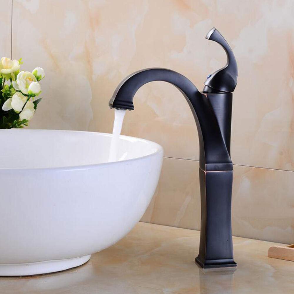 Grifo de lavabo negro antiguo, grifería retro sobre encimera con agua fría y caliente