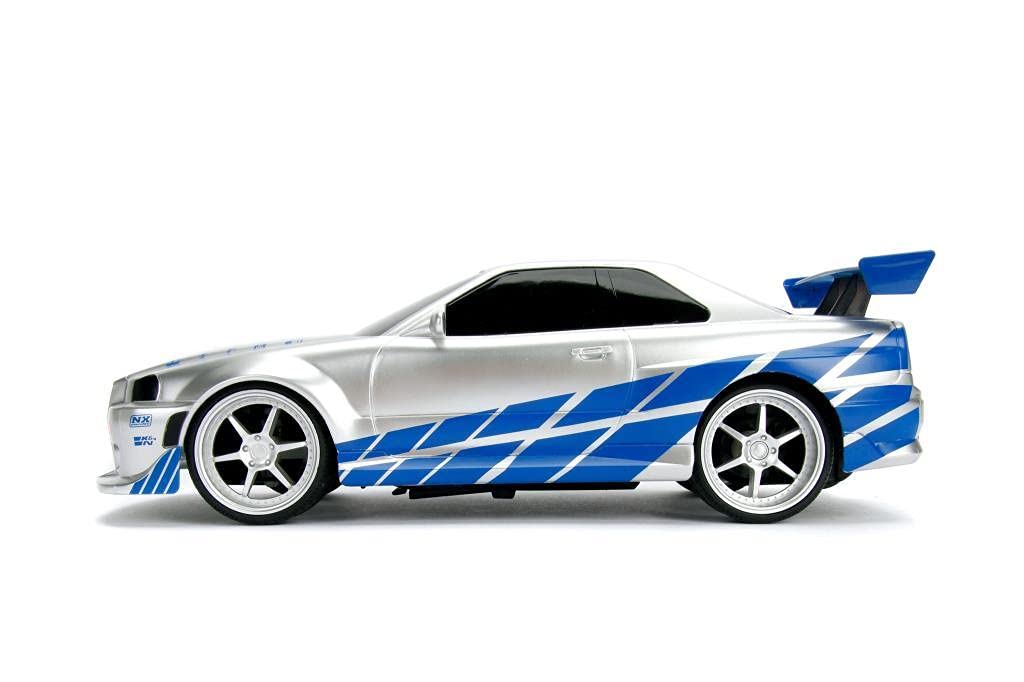 Jada Toys Fast & Furious RC samochód wyścigowy, Nissan Skyline GT-R, R34, samochód zdalnie sterowany, funkcja turbo, dwukanałowy, pilot radiowy, funkcja ładowania USB, baterie w zestawie, 1:16, 29 cm