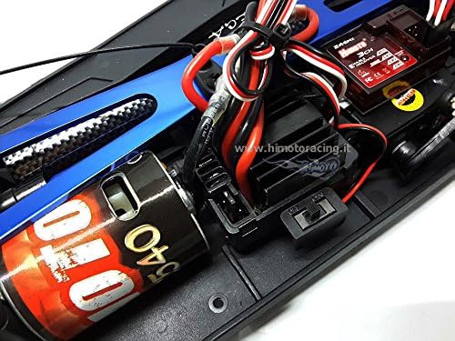 Z bliska view of the RC-540 brushed motor and electronic speed controller (ESC) installed in the HIMOTO NASCADA chassis.