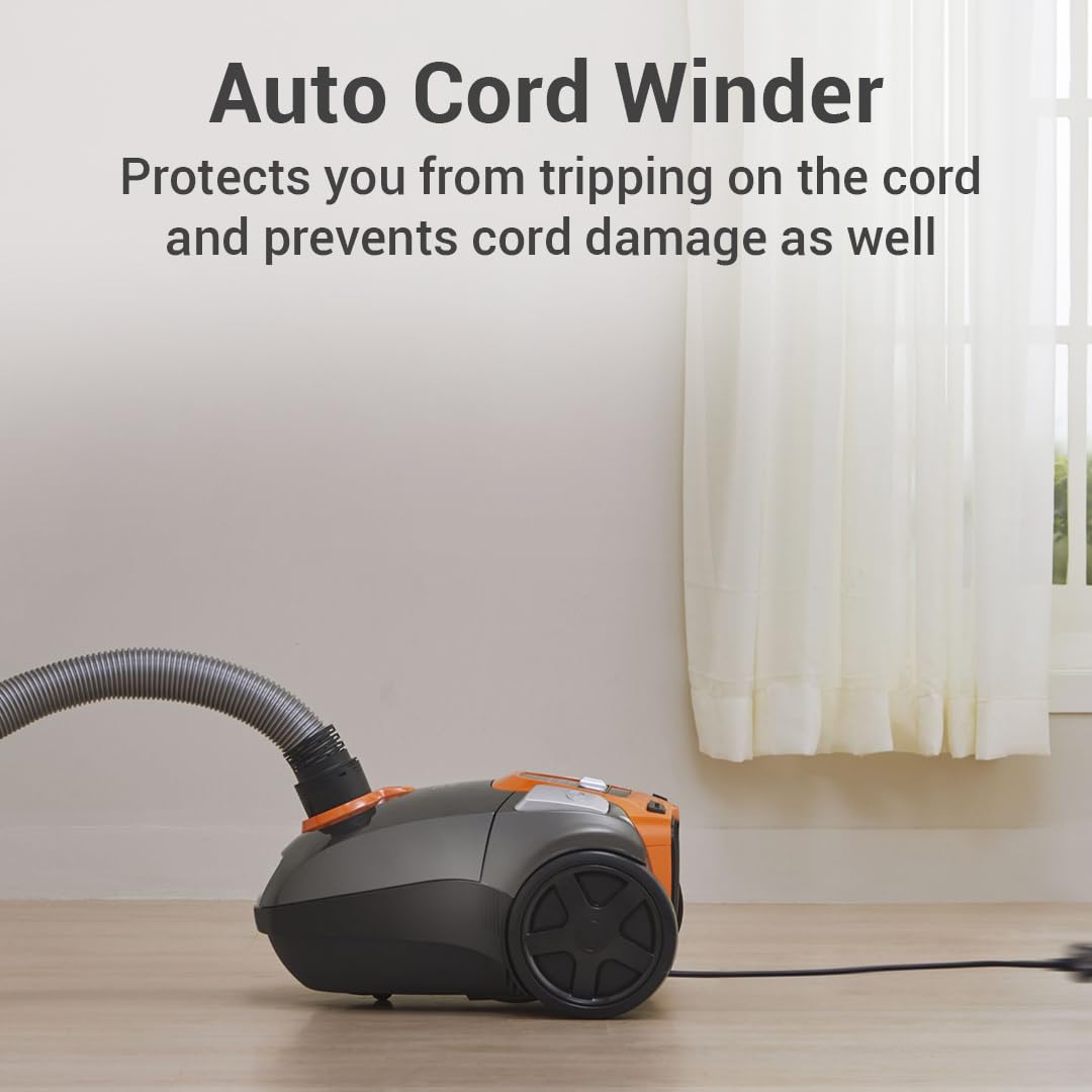Eureka Forbes Stellar vacuum cleaner with its power cord extended, illustrating the auto cord winder feature