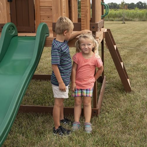 Backyard Discovery Echo Heights Elevated Cedar Wooden Kids Playhouse with Wave Slide, Play Kitchen, Wrap-Around Deck, Flat-Step Ladder, Half Door, Windows, Bell, and Growth Chart for Outdoor Play - image 9