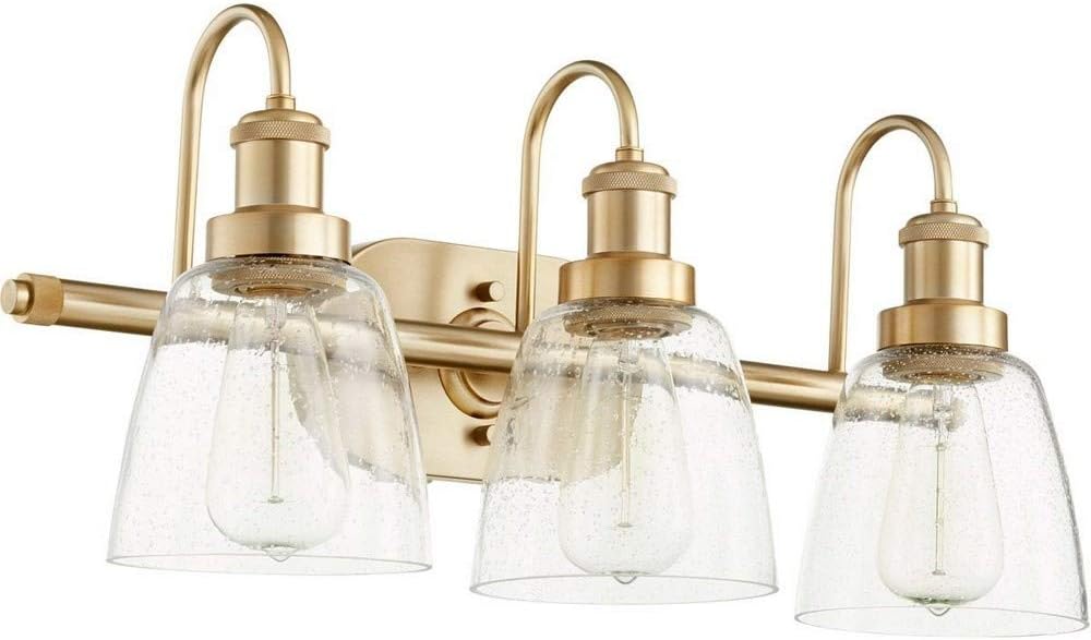 Quorum International Hollis 3-Light Vanity Light | Aged Brass Finish | Clear Seeded Glass Shades | Steel Construction | Transitional Design | Damp Rated | 22.5" W x 10.5" H | 508-3-80
