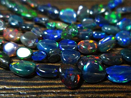 Opale Noire d'Éthiopie Welo de qualité AAA en pépites polies pour éviter les reflets ternes en joaillerie