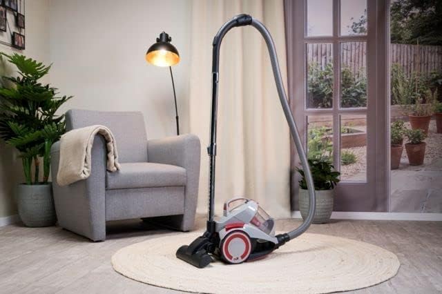 Dirt Devil DD2502 vacuum cleaner fully assembled and ready for use in a living room setting.