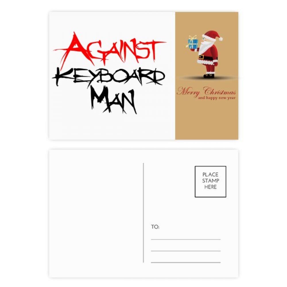 Cartes postales Père Noël contre le clavier pour décorer votre bureau