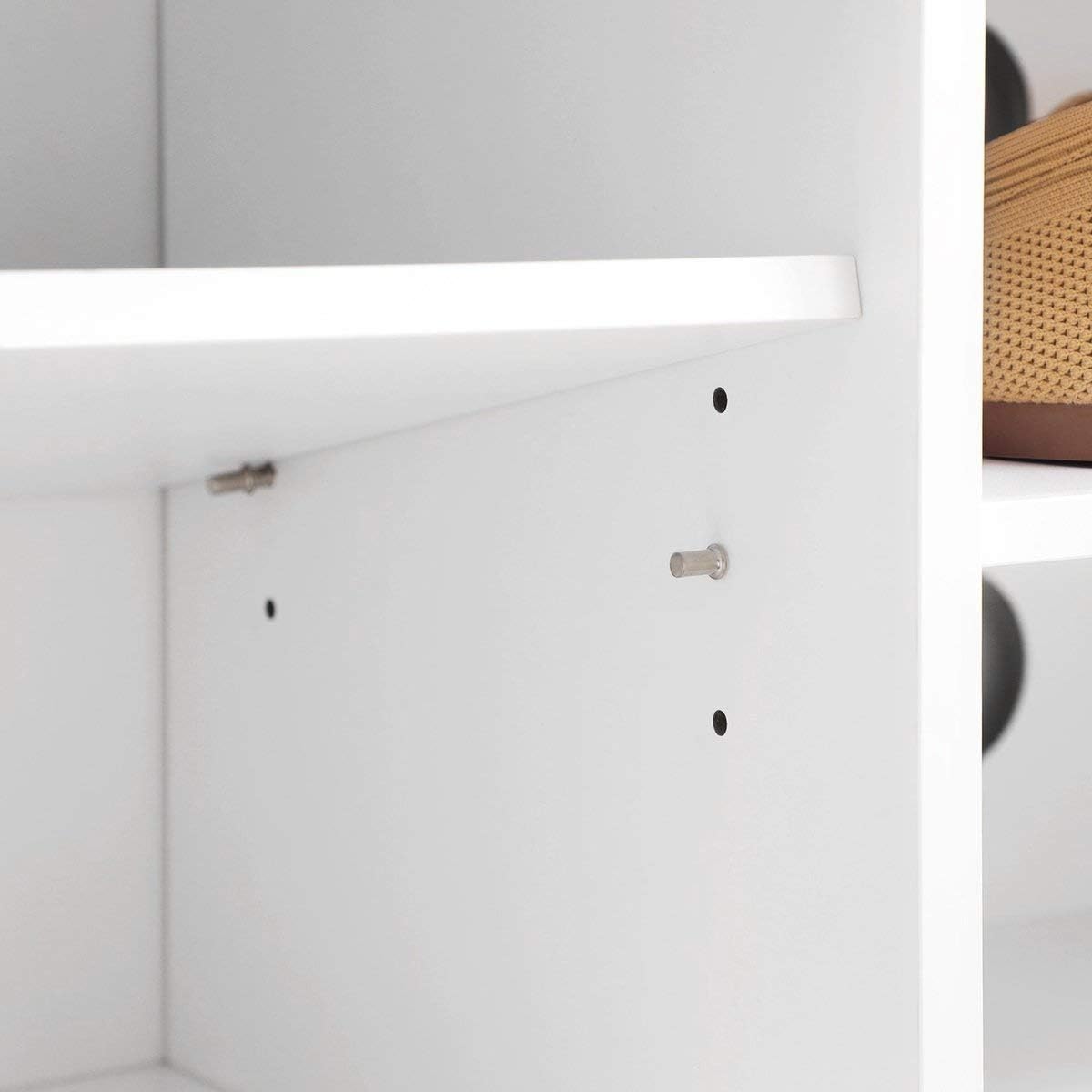 Close-up of adjustable shelf pin holes