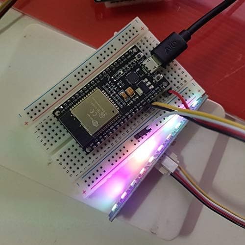 The ESP32-S development board connected to a breadboard with an LED strip, demonstrating a typical application setup.