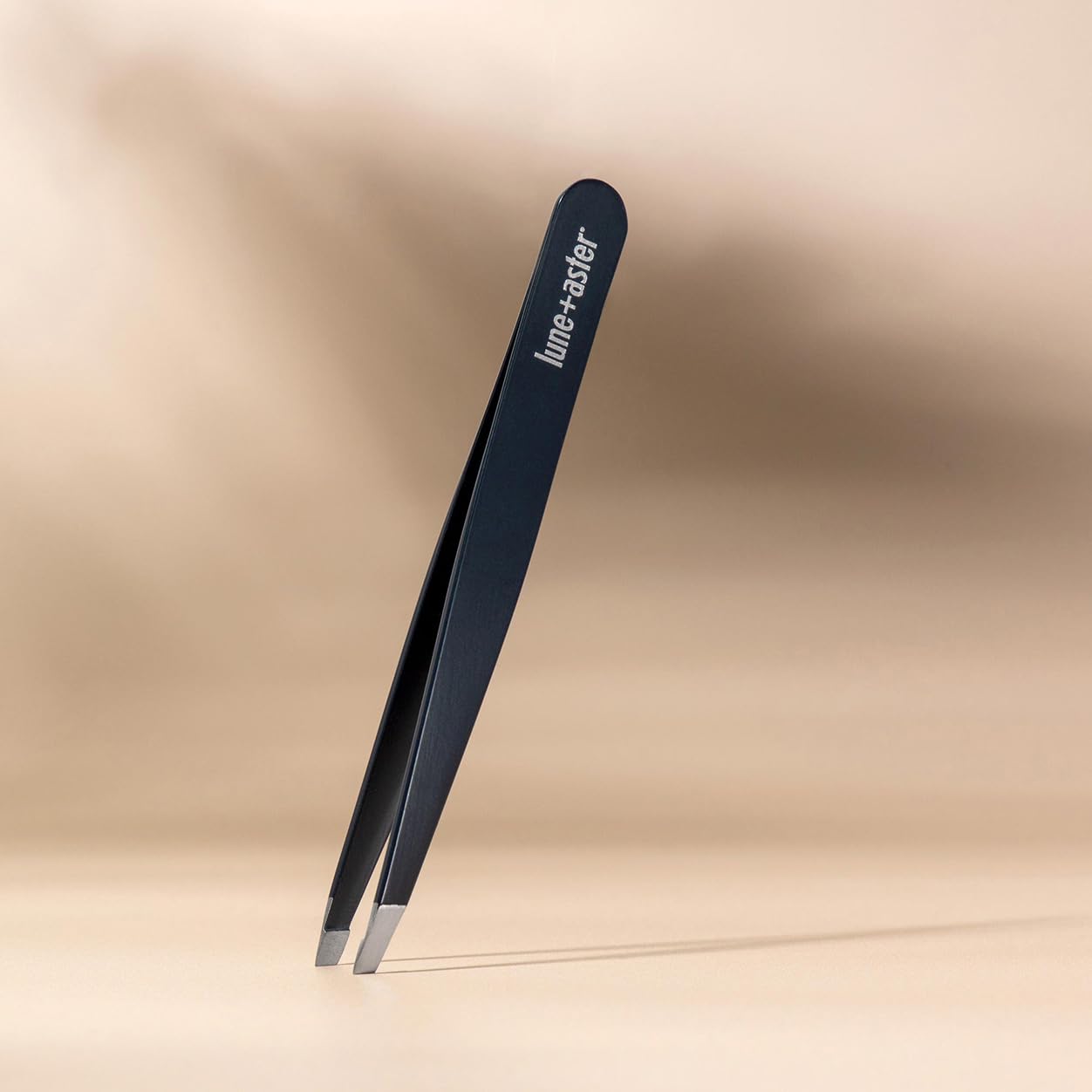 Lune+Aster Slant Tweezer - Stainless steel slant tweezer for at-home brow touch ups and other grooming needs.