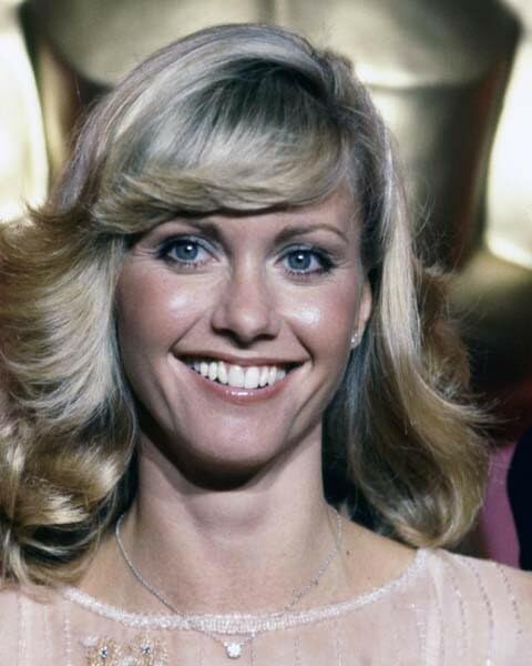 Olivia Newton John 1978 smiling portrait in front of Oscar statue 8x10 photo