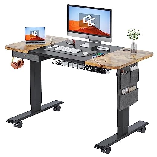 MAIDeSITe Escritorio Eléctrico Regulable en Altura (120 x 60 cm) con 4 Memorias y 5 AccesoriosIncluyendo Cajón, Ruedas Escritorio -Elección Ideal para Escritorio de Oficina en Casa (M1 Pro)