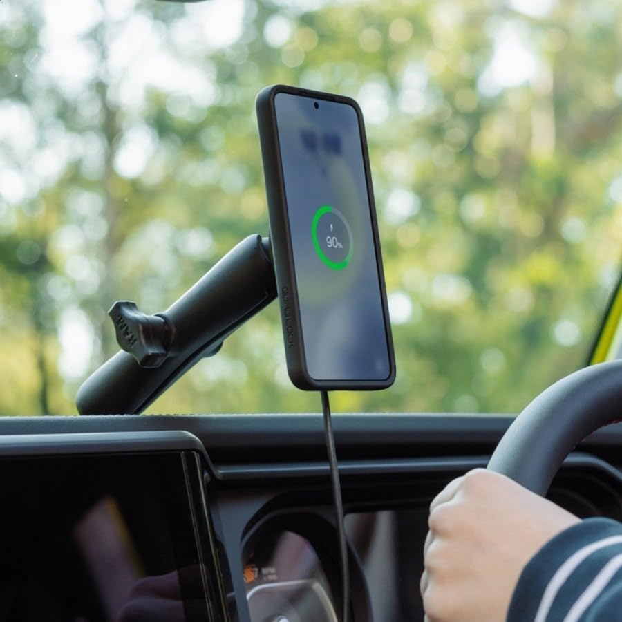 Hand attaching an iPhone in a Quad Lock case to the vehicle mount