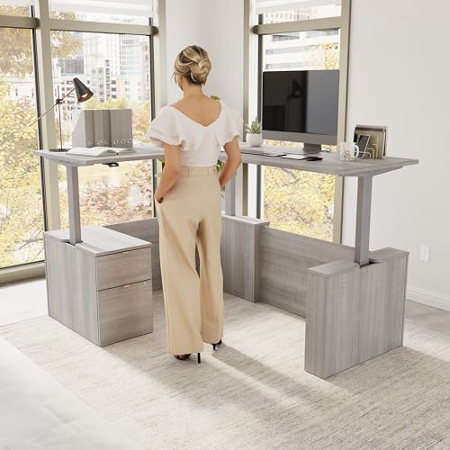Image of Bush Business Furniture 60-inch Height Adjustable L Shaped Standing Desk with File Cabinet, Ergonomic Sit-Stand Computer Table for Office, Stratus Collection, Platinum Gray with Metallic Gray Base