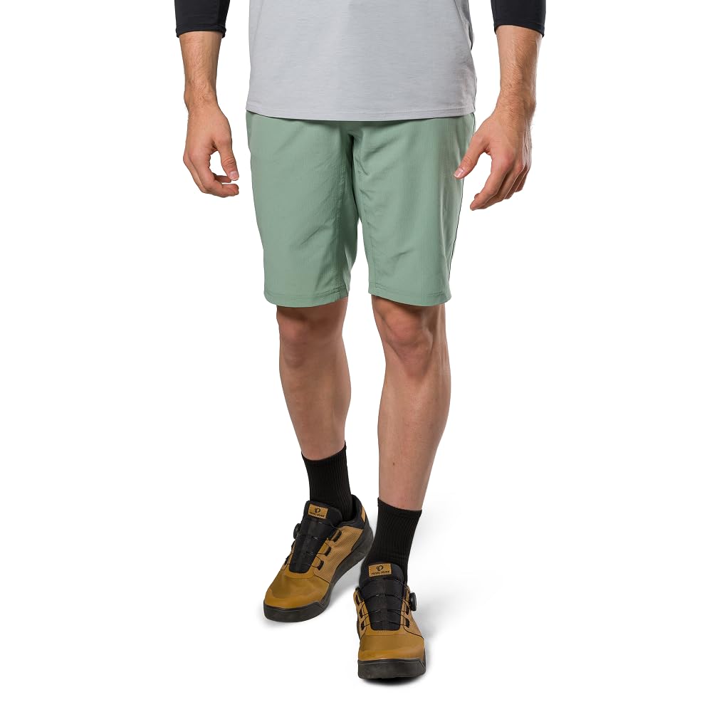 PEARL IZUMI Pantalón corto de ciclismo de montaña para hombre. Forro de gamuza desmontable y dos bolsillos con cremallera. Entrepierna cómoda y duradera de 11.5 pulgadas.