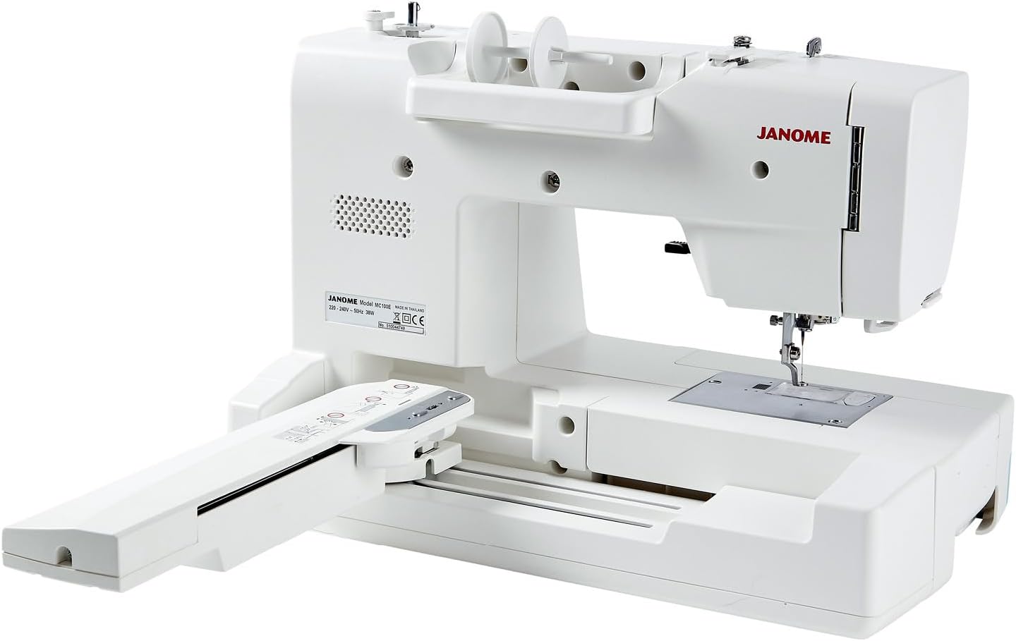 Balik deui view of the Janome Memory Craft 100E with the embroidery arm attached