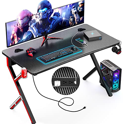 Mr IRONSTONE Gaming Desk 45.2'' with Power Outlets, Computer Desk Gaming Table Carbon Fiber Surface PC Gamer Workstation Laptop Study Table, Home Office Desks with Cup Holder, Headphone Hook, Black Mr IRONSTONE Gaming Desk 45.2'' with Power Outlets, Computer Desk Gaming Table Carbon Fiber Surface PC Gamer Workstation Laptop Study Table, Home Office Desks with Cup Holder, Headphone Hook, Black