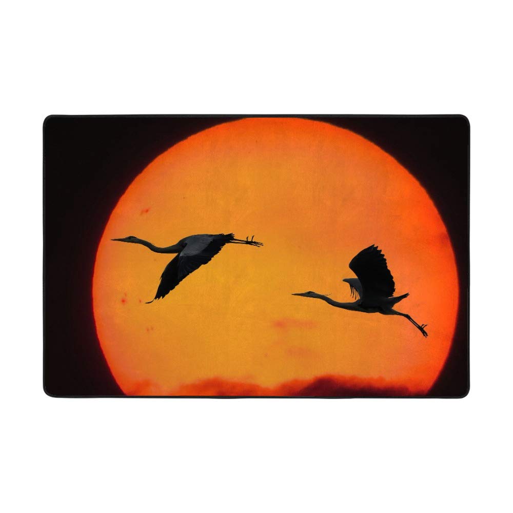 Tapis grand salon grue volante orange pour réchauffer un sol carrelé froid