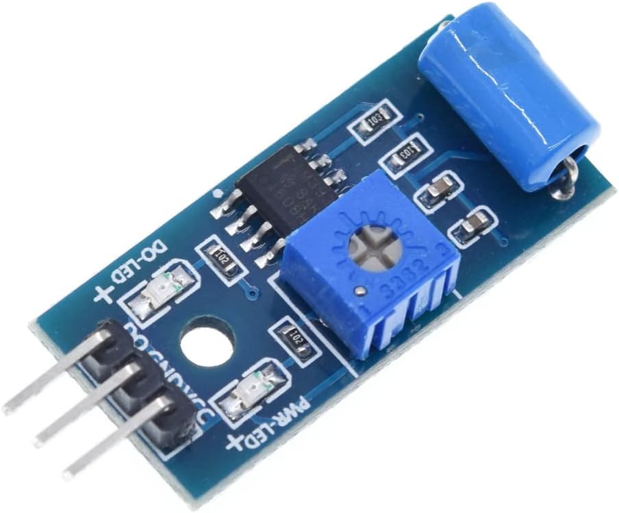 Hornað view of the DollaTek SW-420 Vibration Sensor Module showing the SW-420 sensor, LM393 comparator, potentiometer, and pin headers.