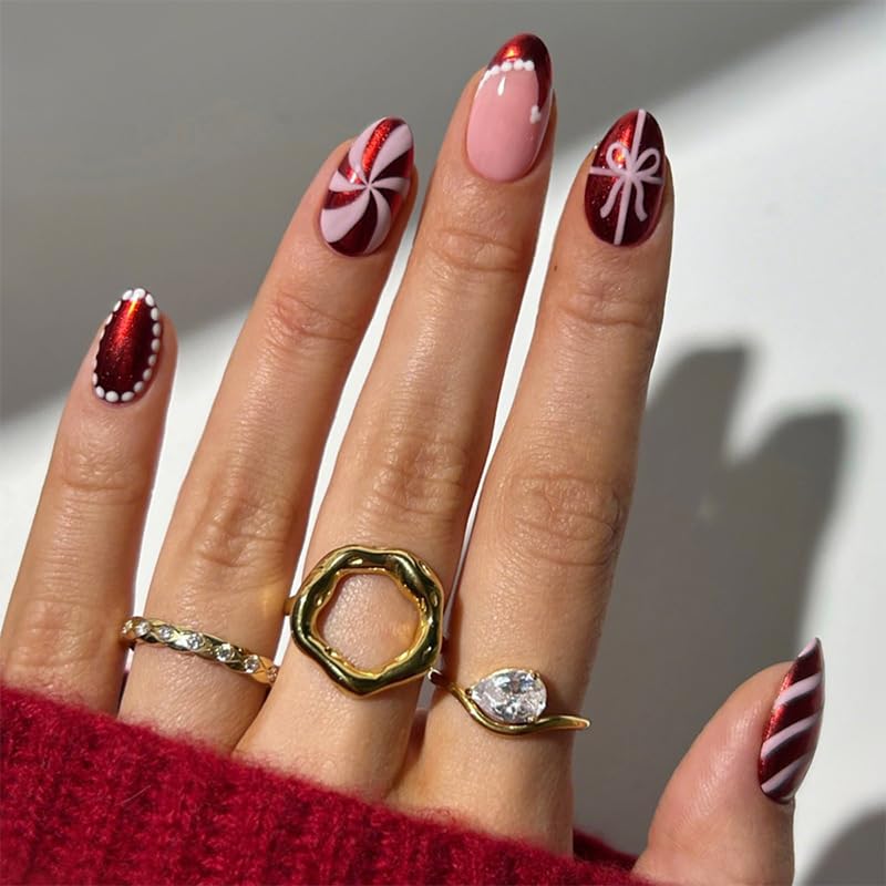 Christmas False Nails - 24Pcs Short Almond Press on Nails - Metallic Wine Red False Nails with Bow and Christmas Hat Designs - Fake Nails with Glue for Women - Full Cover Stick on Acrylic Nails